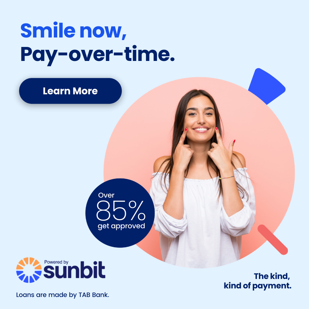 Woman smiling while touching face, promoting dental payment plan offer with 85% approval rate.